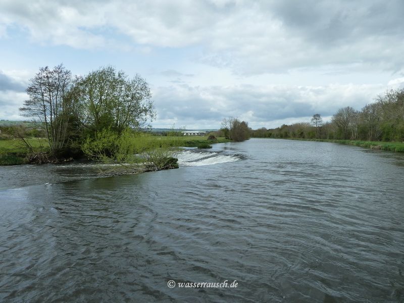 Fenniscourt weir with railway bridge in the distance
