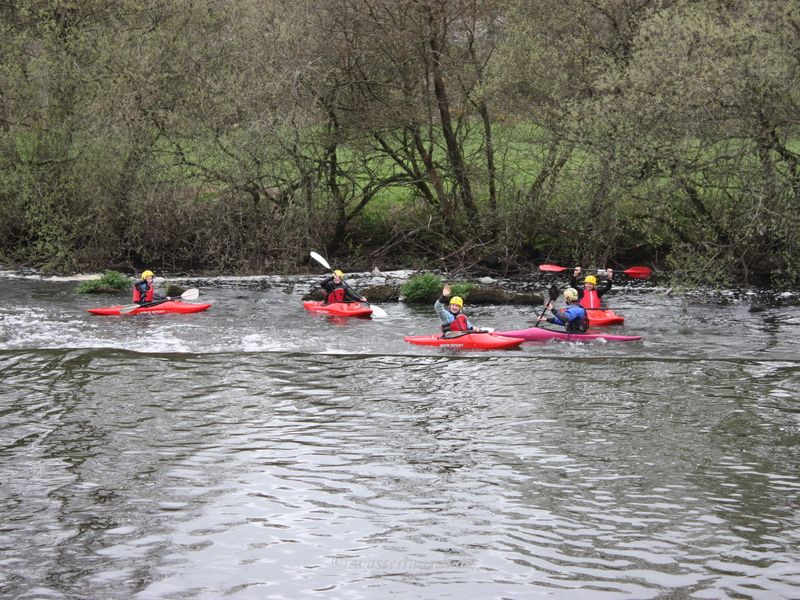 Waving kayakers below Clashganna weir