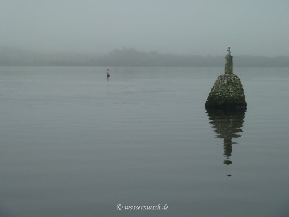 Beacon with red buoy close