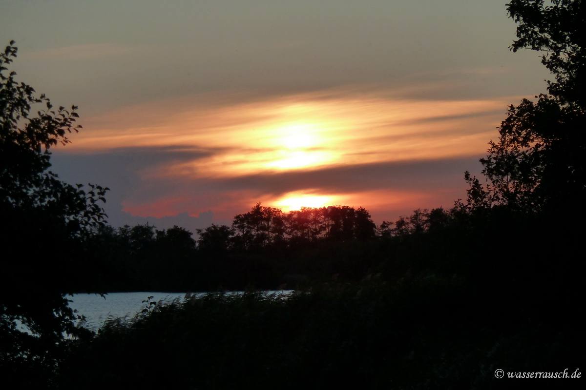 Sunset behind clouds